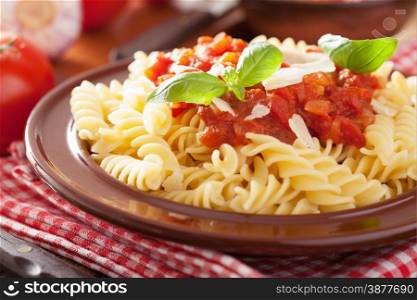 italian classic pasta fusilli with tomato sauce and basil
