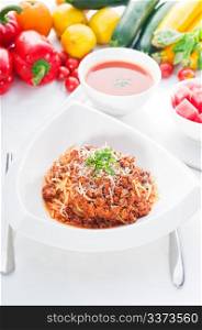 Italian classic spaghetti with bolognese sauce and fresh vegetables on background,MORE DELICIOUS FOOD ON PORTFOLIO
