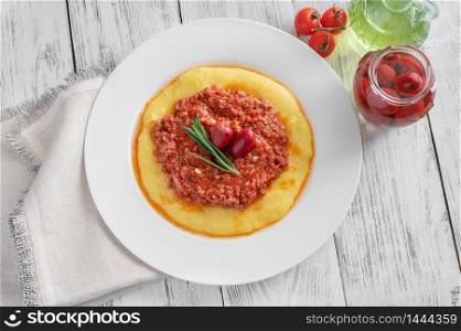 Italian cornmeal polenta with bolognese sauce