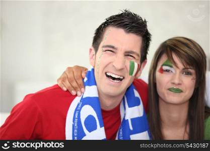Italian couple going to watch a soccer game