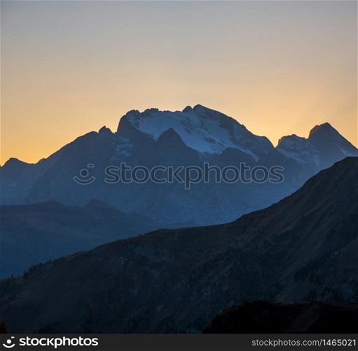Italian Dolomites mountain peaceful hazy evening dusk view from Giau Pass. Climate, environment and travel concept scene.