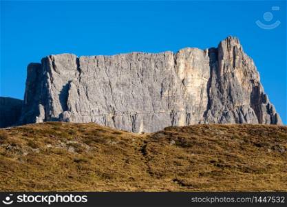 Italian Dolomites mountain rock sunny evening view from Giau Pass. Picturesque climate, environment and travel concept scene.