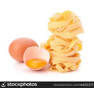 Italian egg pasta fettuccine nest isolated on white background