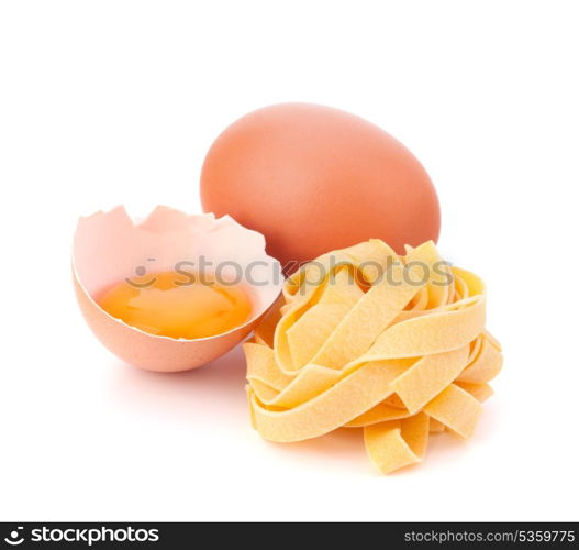 Italian egg pasta fettuccine nest isolated on white background