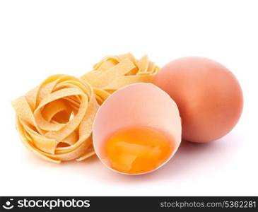 Italian egg pasta fettuccine nest isolated on white background
