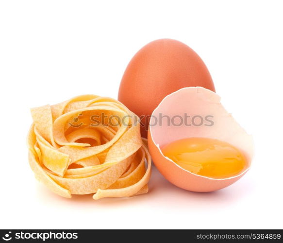 Italian egg pasta fettuccine nest isolated on white background