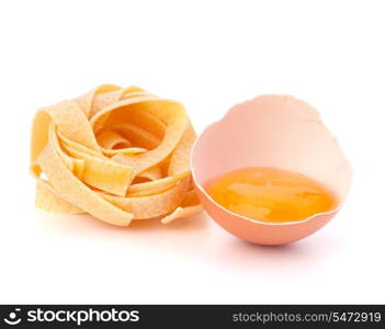 Italian egg pasta fettuccine nest isolated on white background