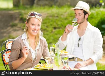 Italian elegant young couple dining at outdoor restaurant terrace