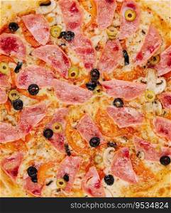 Italian fast food. delicious hot pizza with ham and ch&ignons sliced