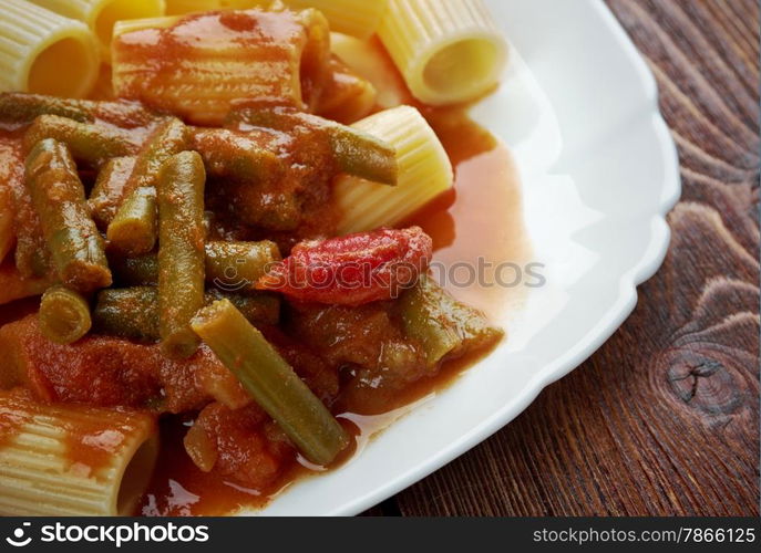 Italian food. Pasta Rigatoni with green beans and tomato sauce