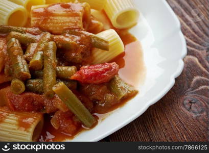 Italian food. Pasta Rigatoni with green beans and tomato sauce