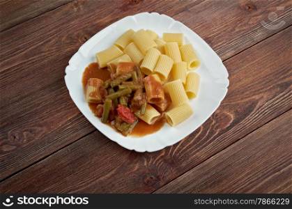 Italian food. Pasta Rigatoni with green beans and tomato sauce