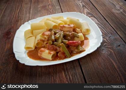Italian food. Pasta Rigatoni with green beans and tomato sauce