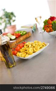 Italian food - pasta, tomato and olive oil, ingredients for cooking