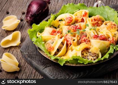 Italian foods concept.Italian style stuffed pasta shells with meat.Stuffed ricotta cheese shells.. Pasta stuffed with meat