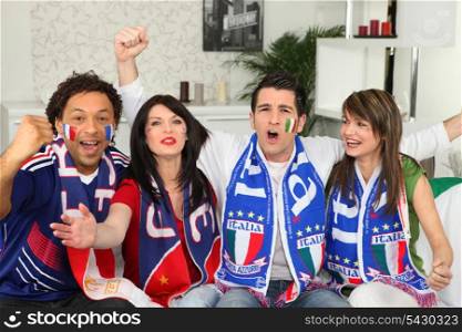 Italian football supporters watching match from home