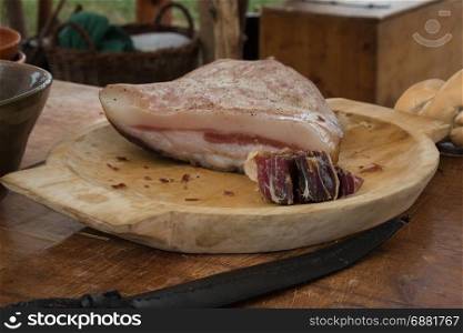 Italian Lard in Wooden Plate on Brown Table