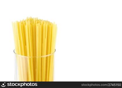 italian long spaghetti pasta on a glass container isolated on white background