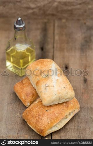 Italian olive bread rolls in rustic kiched setting