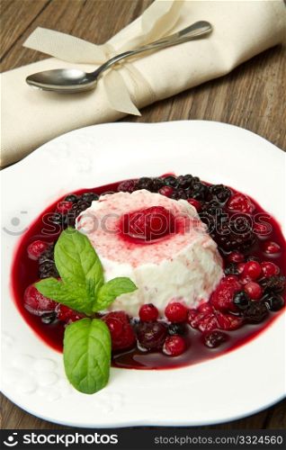 italian panna cotta dessert with fresh berries