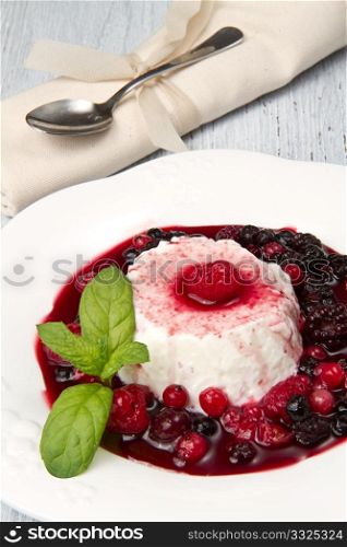 italian panna cotta dessert with fresh berries