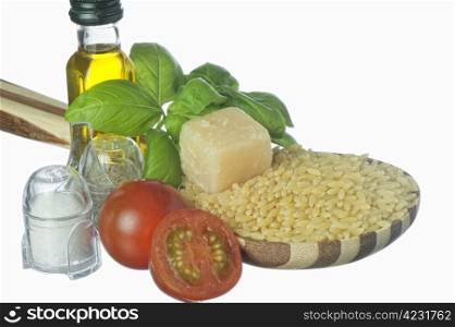 Italian pasta and ingredients for dressing on a white background