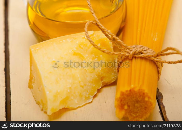 Italian pasta basic food ingredients parmesan cheese and extra virgin olive oil