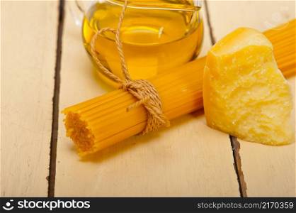Italian pasta basic food ingredients parmesan cheese and extra virgin olive oil