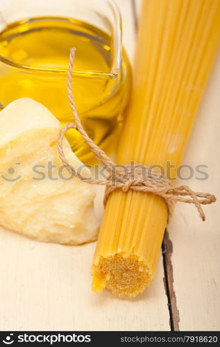 Italian pasta basic food ingredients parmesan cheese and extra virgin olive oil