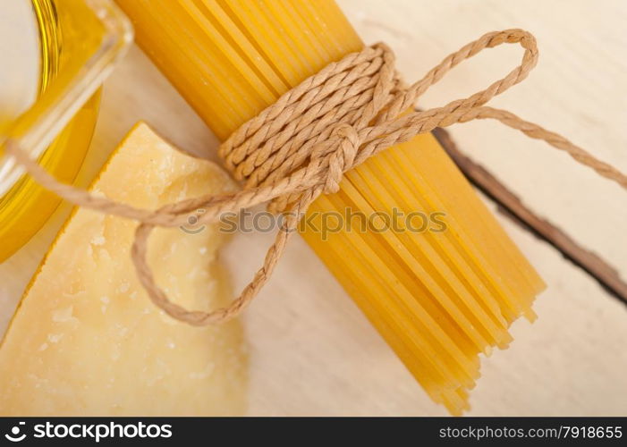 Italian pasta basic food ingredients parmesan cheese and extra virgin olive oil