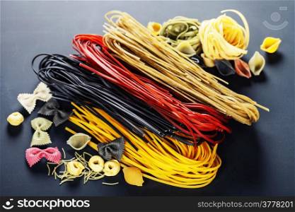 italian pasta, different varieties on dark background