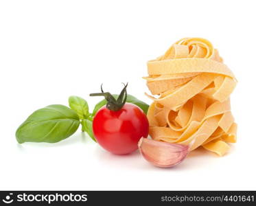 Italian pasta fettuccine nest and cherry tomato isolated on white background