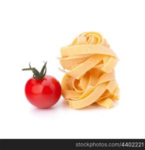 Italian pasta fettuccine nest and cherry tomato isolated on white background