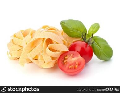 Italian pasta fettuccine nest and cherry tomato isolated on white background