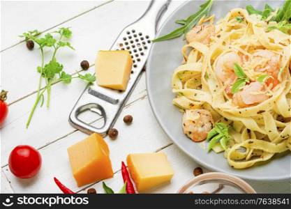Italian pasta fettuccine with shrimp on a plate. Fettuccine pasta with shrimp