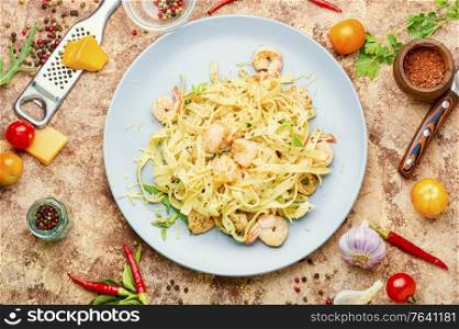 Italian pasta fettuccine with shrimp on a plate. Fettuccine pasta with shrimp