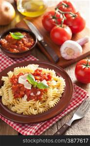 italian pasta fusilli with tomato sauce and basil