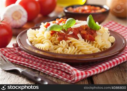 italian pasta fusilli with tomato sauce and basil