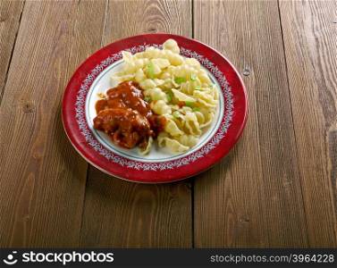 Italian pasta Orecchiette with chicken and tomato sauce