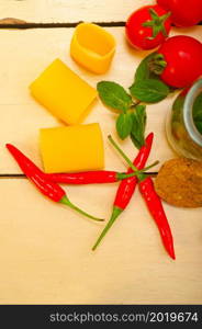 Italian pasta paccheri or schiaffoni with tomato mint and chili pepper ingredients