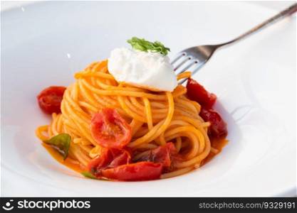 Italian pasta - spaghetti with mozzarella cheese closeup, mediterranean diet