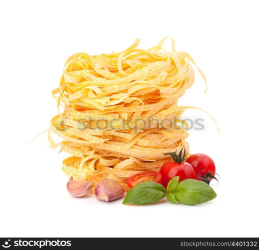 Italian pasta tagliatelle nest and cherry tomato isolated on white background