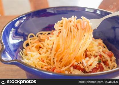 Italian pasta with ham, tomato and champignon mushrooms, stock photo