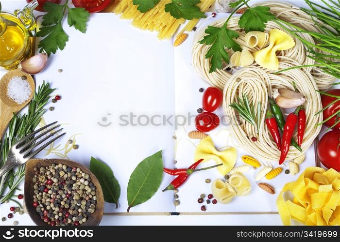 Italian Pasta with tomatoes, garlic, olive oil and pepper on a blanc notebook (with space for text)