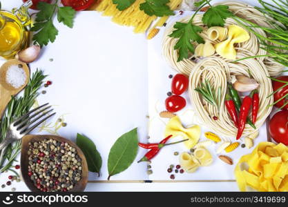 Italian Pasta with tomatoes, garlic, olive oil and pepper on a blanc notebook (with space for text)