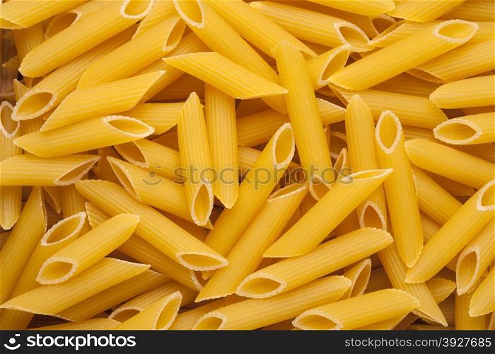 Italian Penne Rigate Macaroni Pasta raw food background or texture close up
