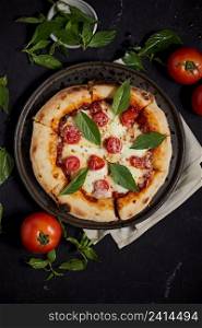 Italian pizza Margherita with basil leaves . Italian pizza Margherita