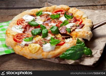 Italian pizza served on wooden table