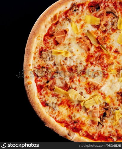 italian pizza with sliced ham and artichokes on black background