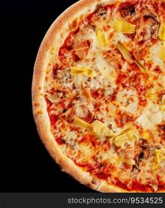 italian pizza with sliced ham and artichokes on black background